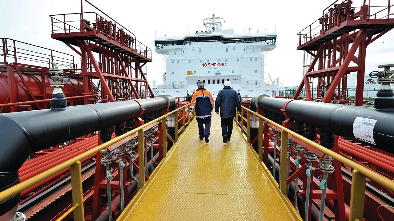 Shell employee walking along on a tanker