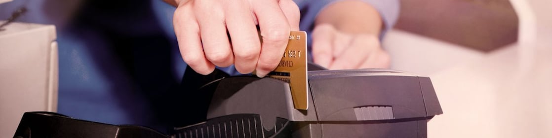 person swiping creditcard