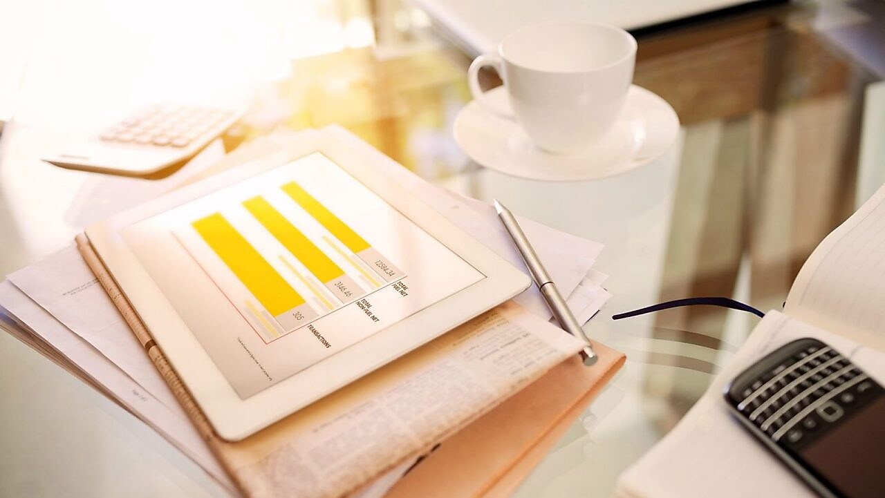 tablet and notes on a desk