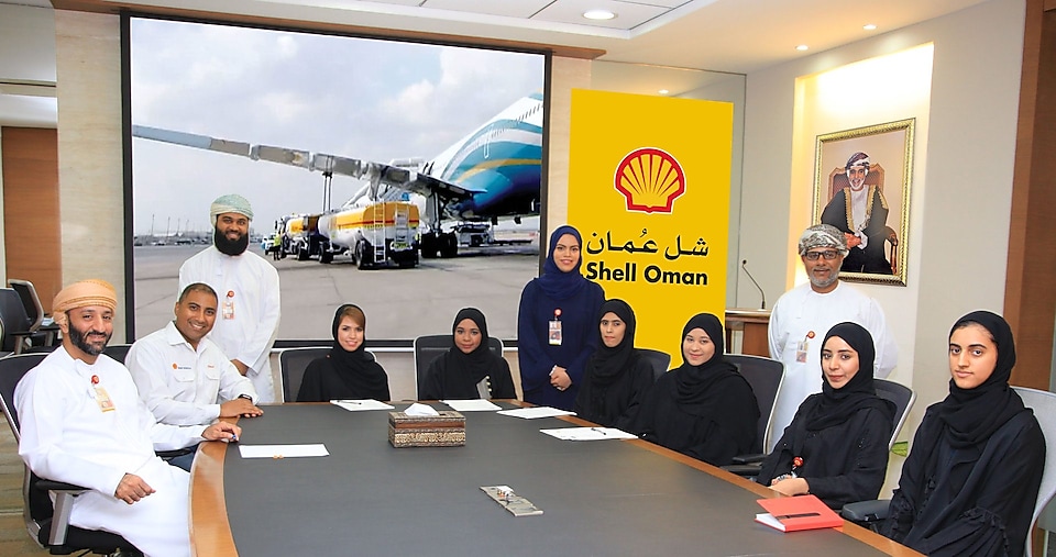 Shell Oman aviation team sitting around a table