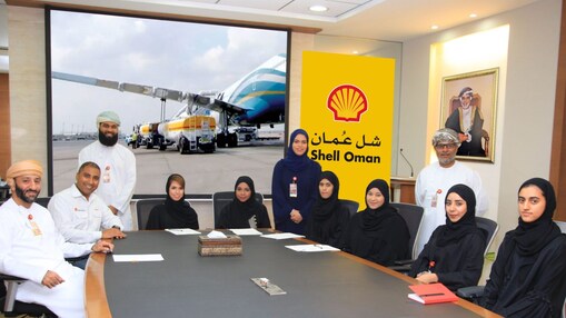 Shell Oman aviation team sitting around a table