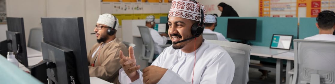 A man sitting at her desk in office