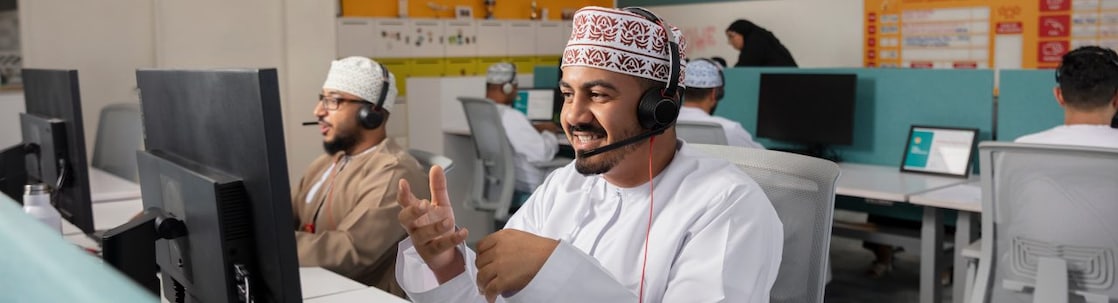 A man sitting at her desk in office