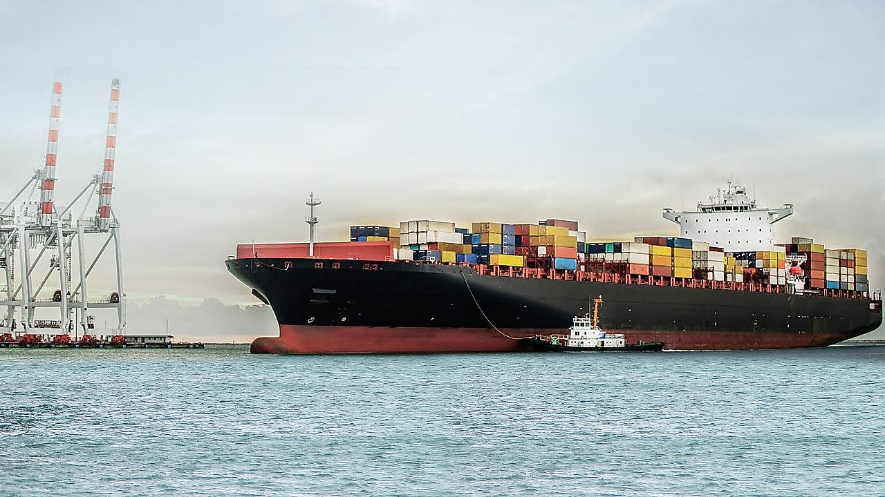 Large tanker at sea loaded with container crates