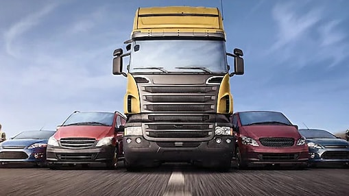 Motorcycles, cars and trucks on road