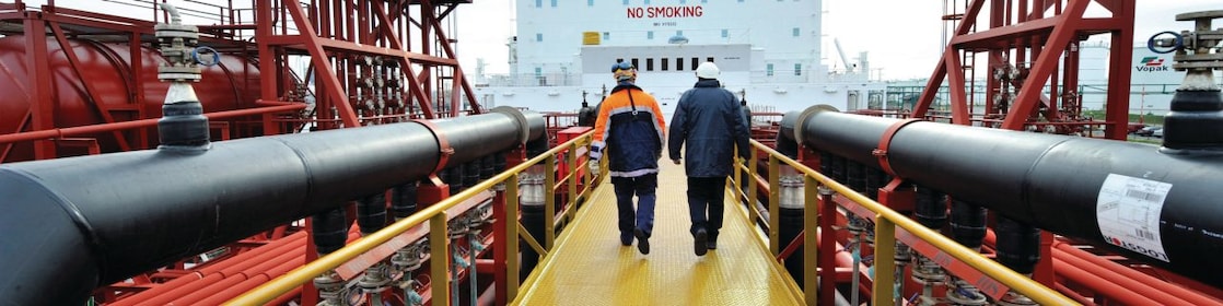 Shell employee walking along on a tanker