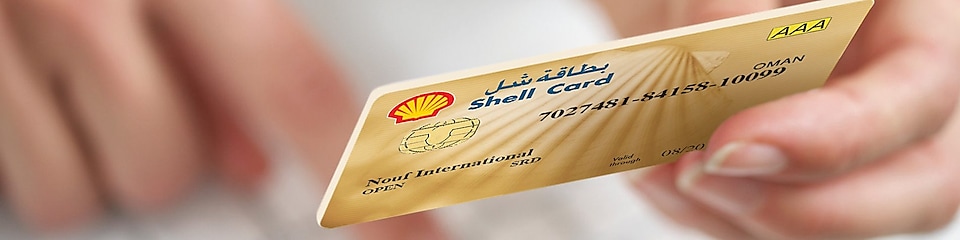 Person holding Shell card 