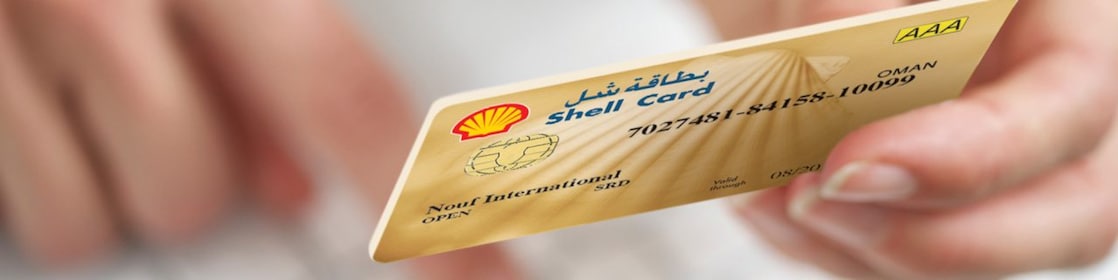Person holding a Shell card