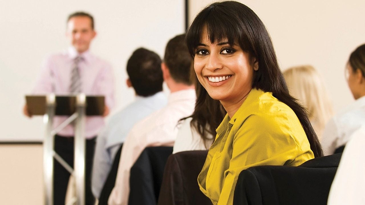  Female employee in conference