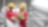 Shot of two workers in hardhats discussing a project in a refinery