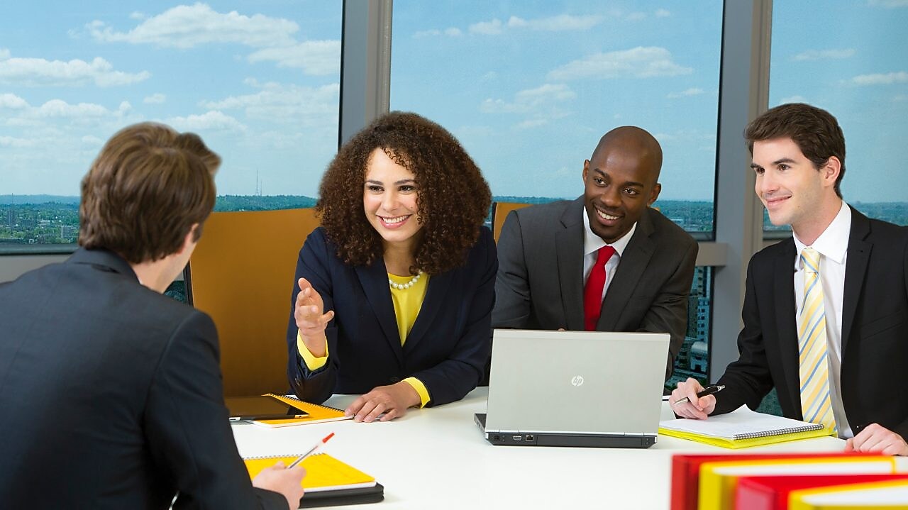 four shell employees in a meeting