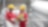 Shot of two workers in hardhats discussing a project in a refinery