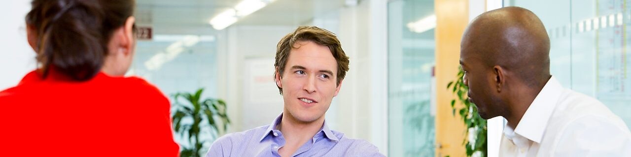 two employees interviewing a potential candidate