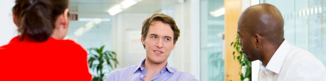 two employees interviewing a potential candidate