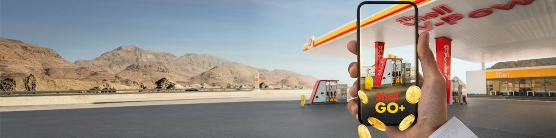 Oman Shell Service Station, with smart phone displaying the new loyalty app