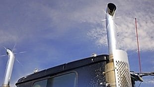 Roof and top of a truck showing exhaust pipes