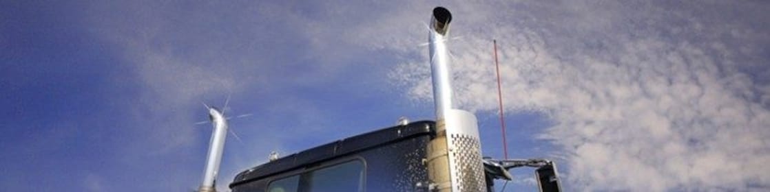 Roof and top of a truck showing exhaust pipes