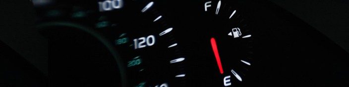 Dashboard display in car showing low fuel