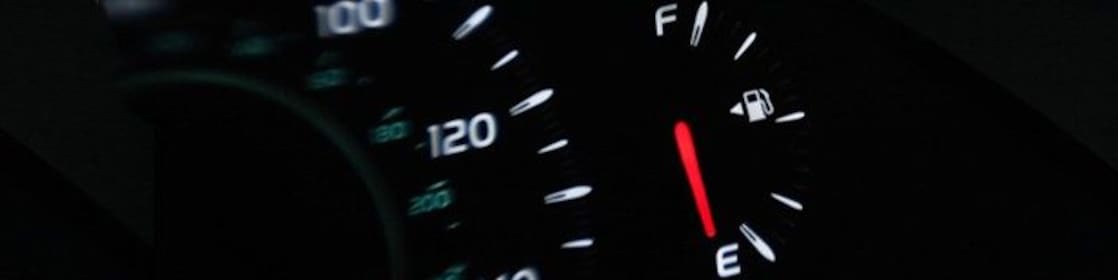 Dashboard display in car showing low fuel