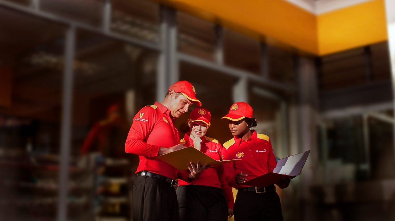 3 Shell employees discussing
